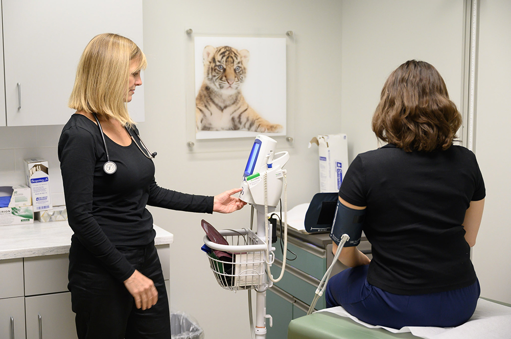 Amanda Jacobs, MD with a patient